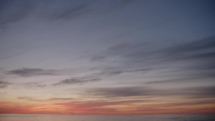 A view of an ocean and horizon just after the sun has set