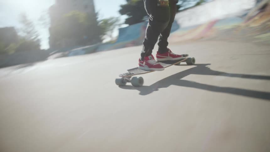 Person rides skateboard at skate park