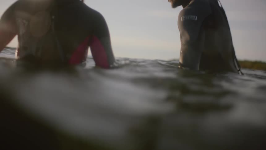 A man and woman swimming in the ocean