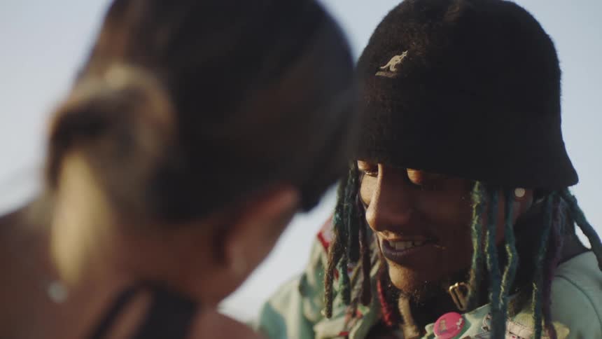 A man and woman talking outdoors