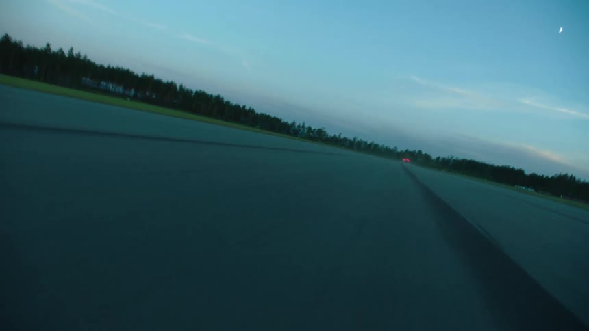 A car driving by quickly on a track