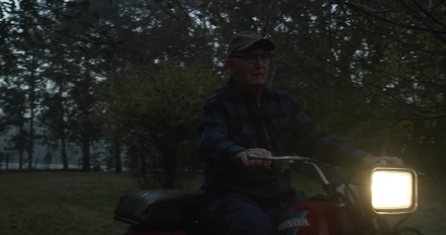 A man riding a motorized trike outdoors