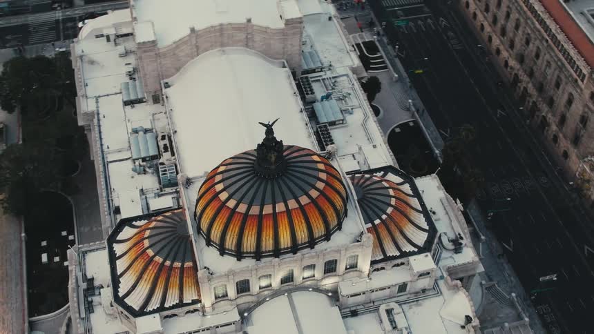 Orange ornate dome tops building in city