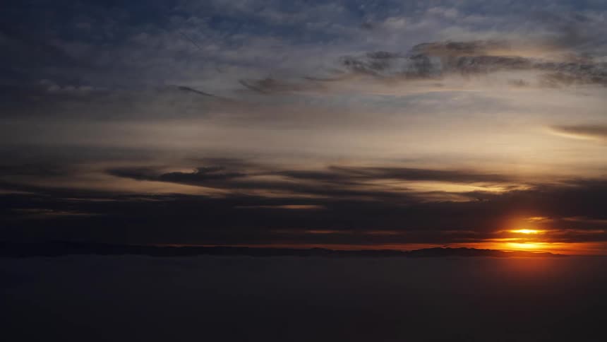Time lapse of the sun setting on the horizon