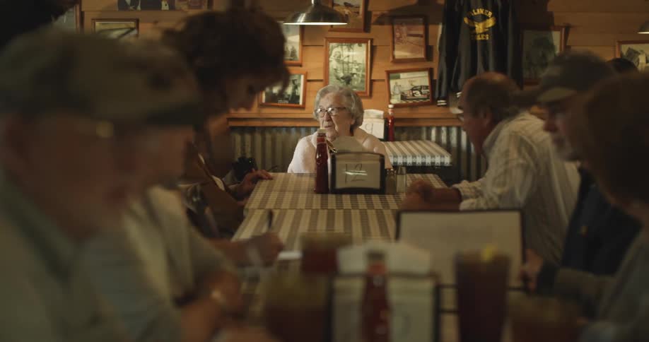 People sit in the restaurant ordering and talking