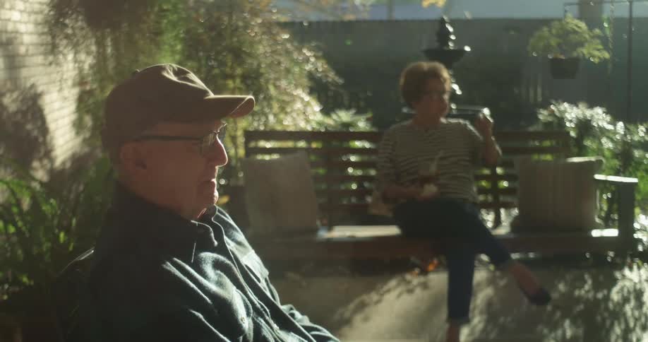 Old couple sitting outdoors
