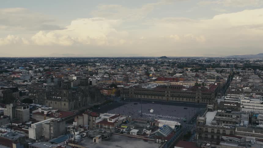 Aerial view of a city with many people out walking in town