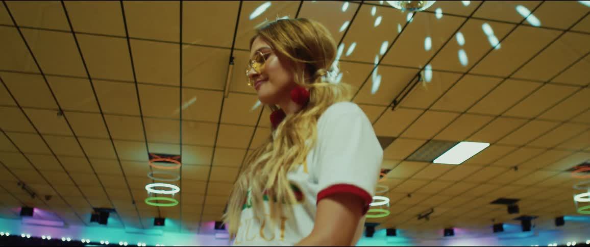 A woman dancing in a room at a club