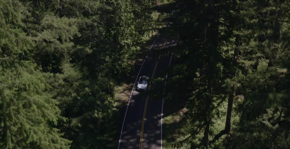 Aerial view of a car traveling down a road