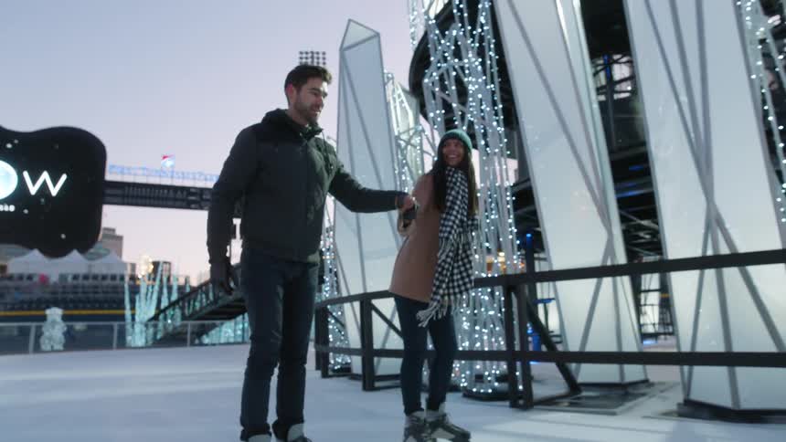 People ice skate on a rink