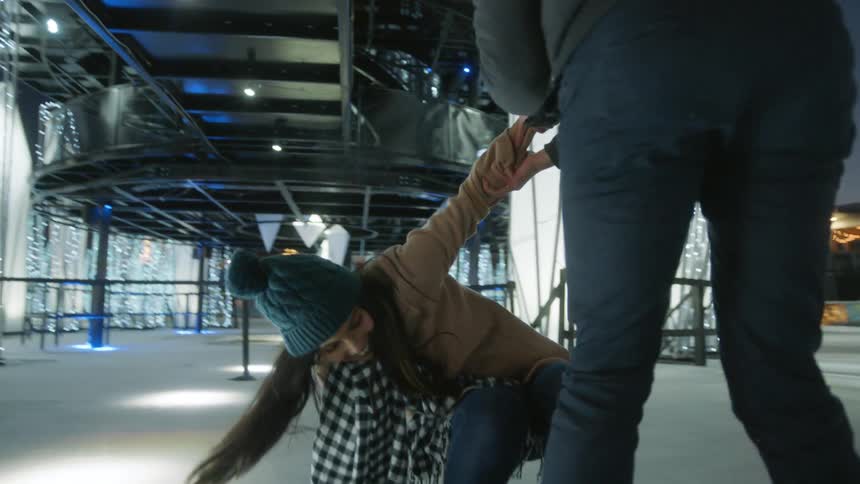 Couple hugging in the ice skating park