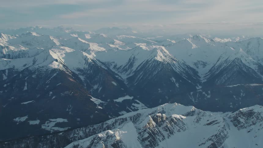 An aerial view of a snow capped mountains
