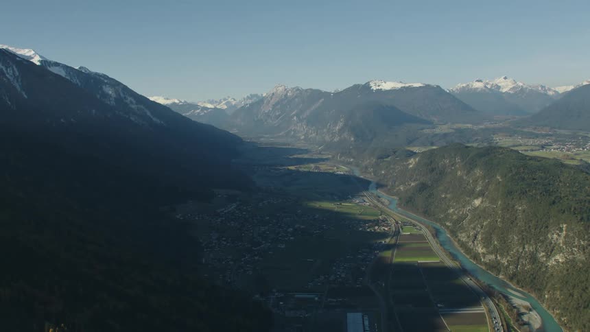 The shadow from the mountains cover the rural town