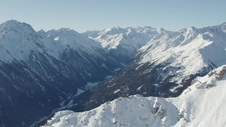 The tall mountains are covered with snow
