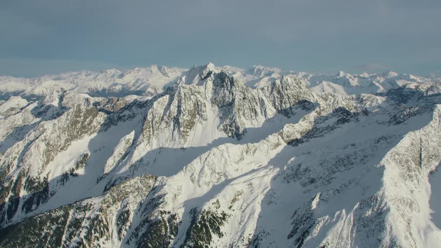 The mountain range is covered in frost
