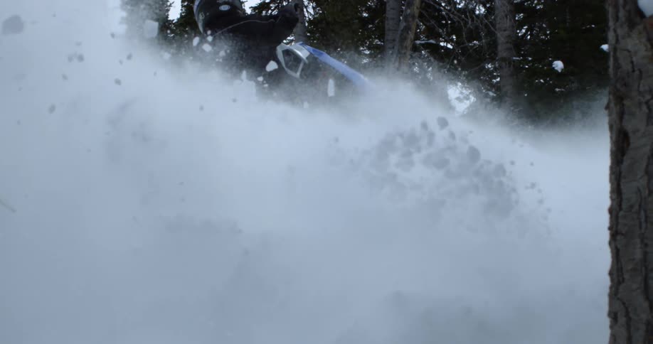 A person rides through the snow