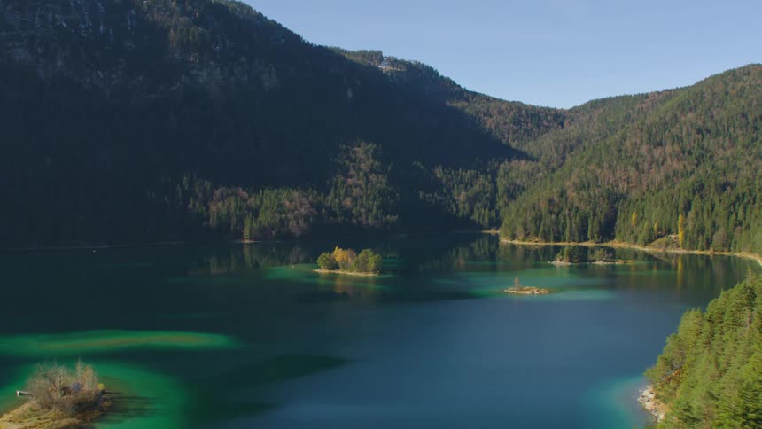 An aerial view of a lake on a mountain