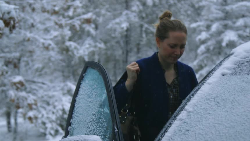 Woman go through her frozen car