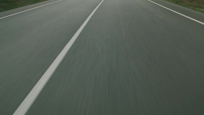 Driving down a road during the day