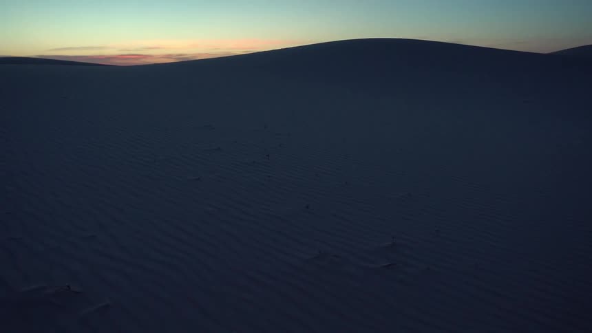 The sun sets over the hills