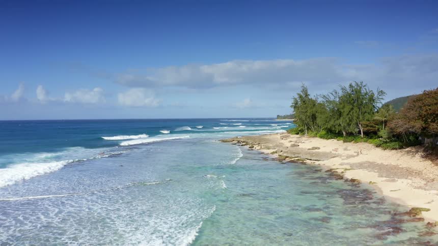 The island is surrounded by blue water
