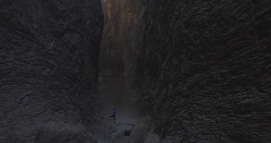 View of someone standing in mountain crevice