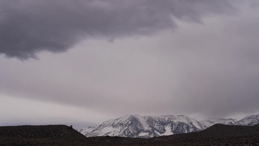 A view of clouds forming over a mountain