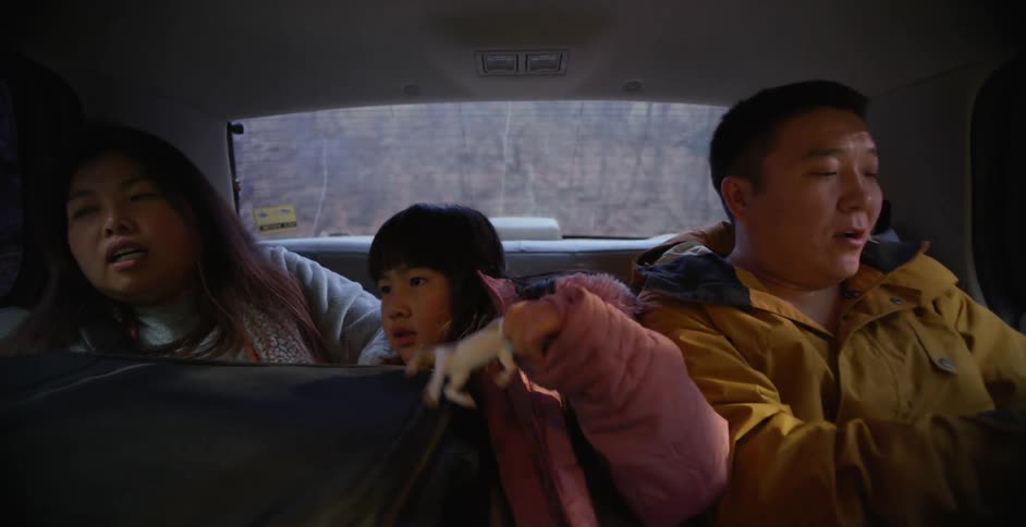 A family get into the taxi together