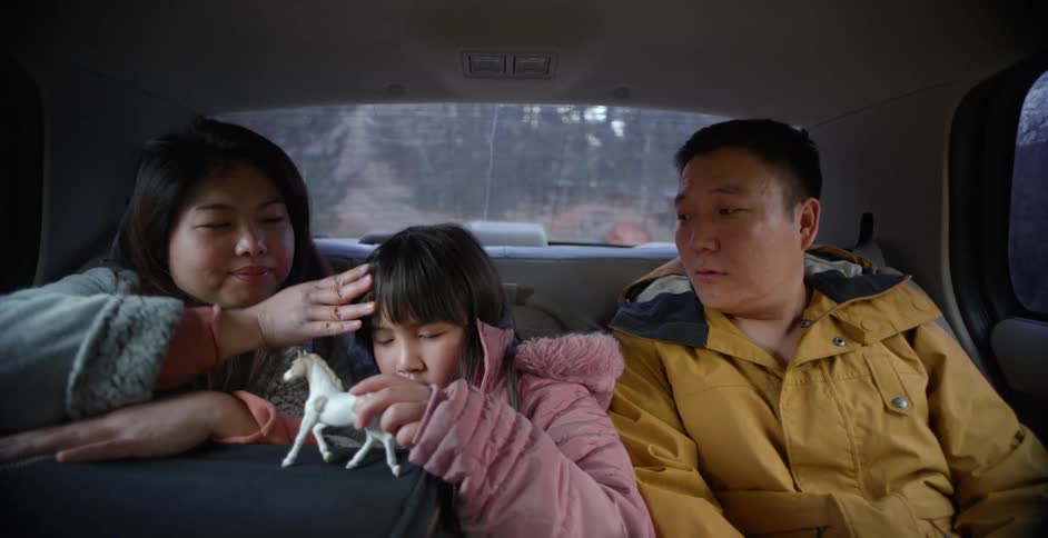 A family are inpatient as they ride in the taxi