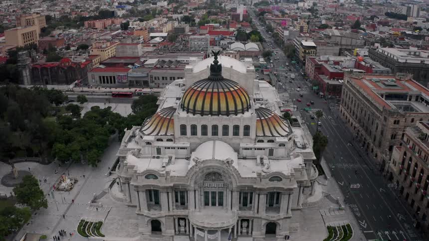 Aerial view of the Fine Arts Palace in Mexico City surrounded by trees and buildings