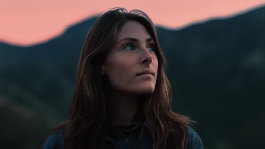 A portrait of a woman standing outdoors