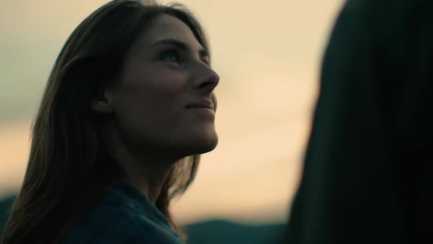 A portrait of a woman standing outdoors