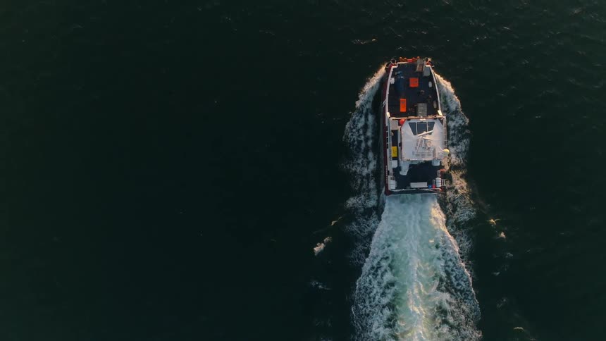 An aerial view of a ship sailing
