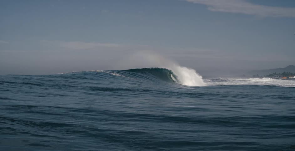 Colours of the rainbow reflected in breaking ocean waves