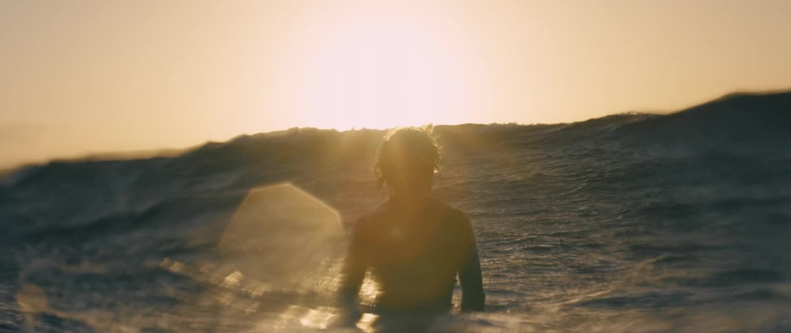 Person standing in between waves