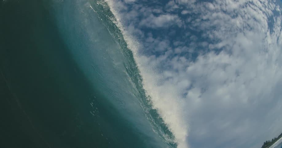 A large wave crashing in the ocean