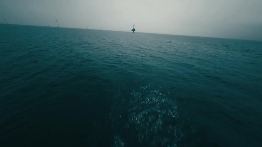 Boat travels to offshore wind farm