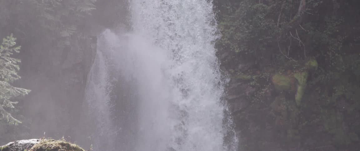 Waterfalls are flowing down the side of a mountain