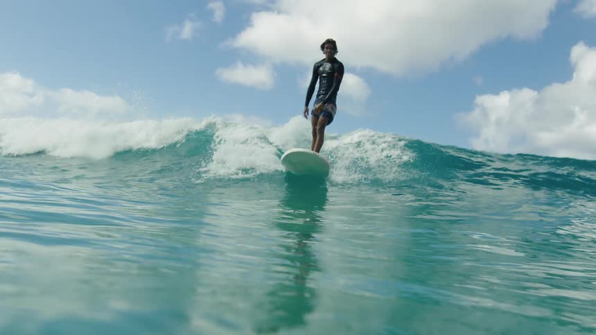 A view of a person surfing on the water