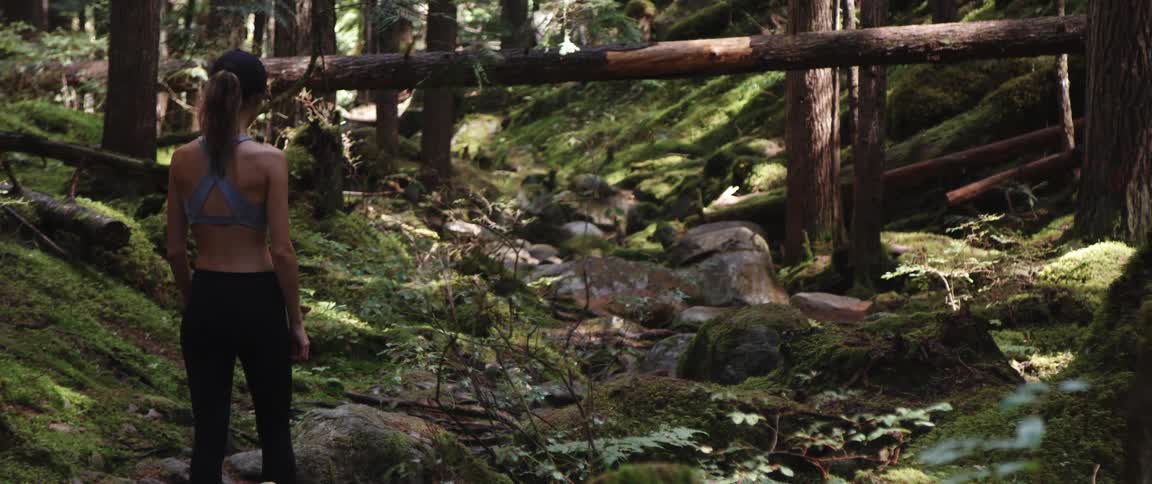 A woman is hiking in the wilderness