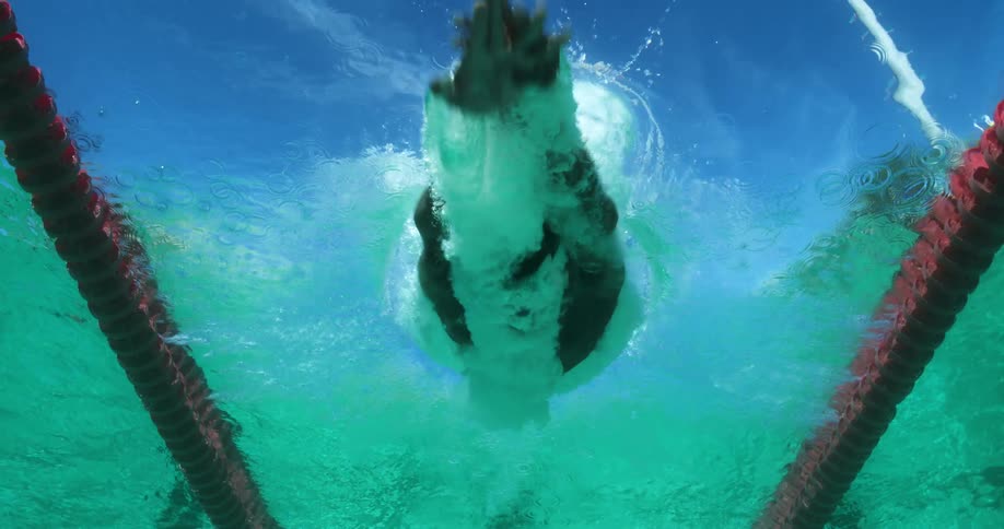 A person is diving into a pool of water