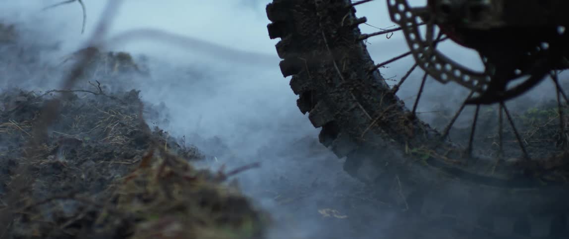 Fog moving over the wheel of a motorcycle