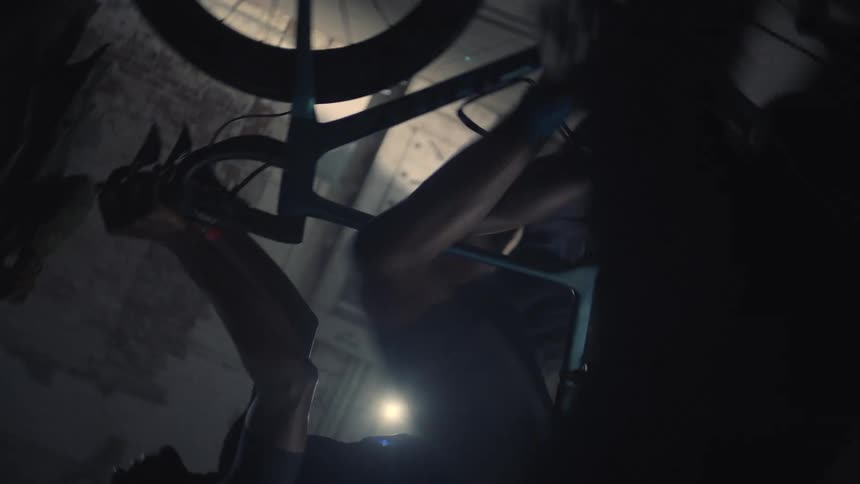 A cyclist is peddling a bike that stays in place