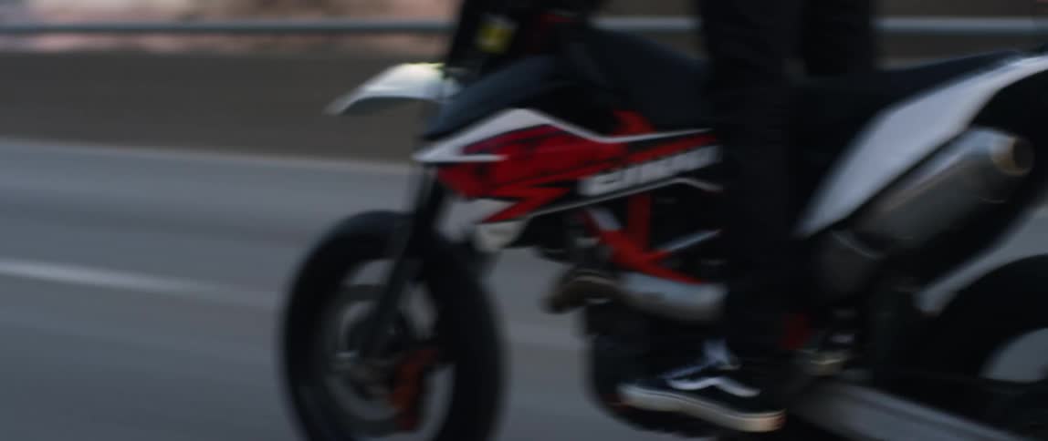 A man races his motorcycle on the road