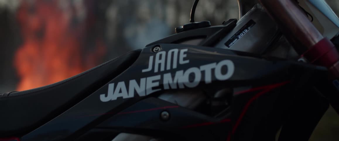 A motorcycle in front of a bonfire