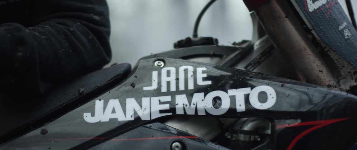 Close up of the brand logo of a motorcycle manufacturer on a bike in the forest