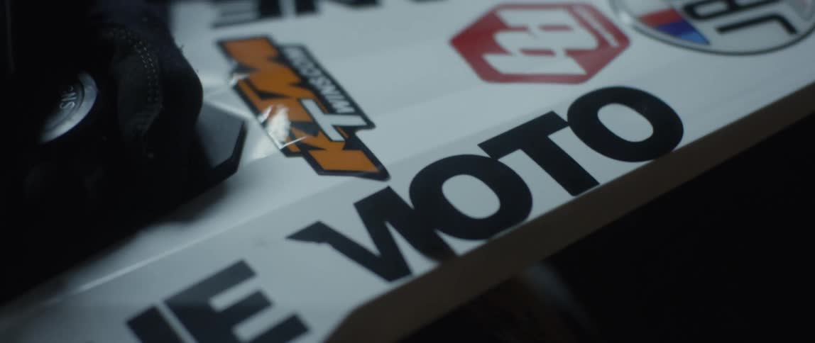 A person is touching the logos