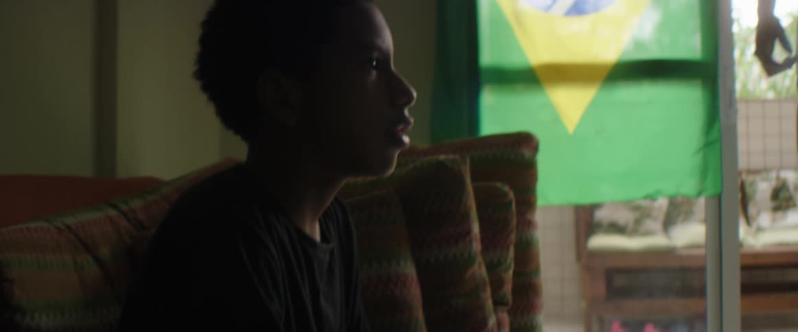 Two boys are inside their house and playing sports