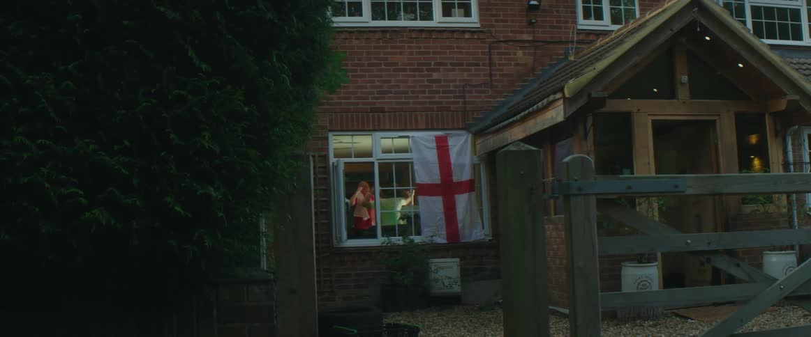 Group of friends celebrate watching a game on the living room at home