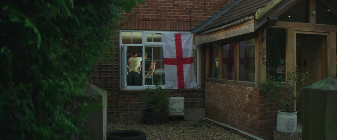 People are celebrating indoors next to a window